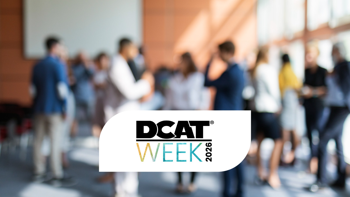 Out-of-focus photo of a room full of people at a tradeshow, with DCAT Week 2026 logo overlaid on the photo.