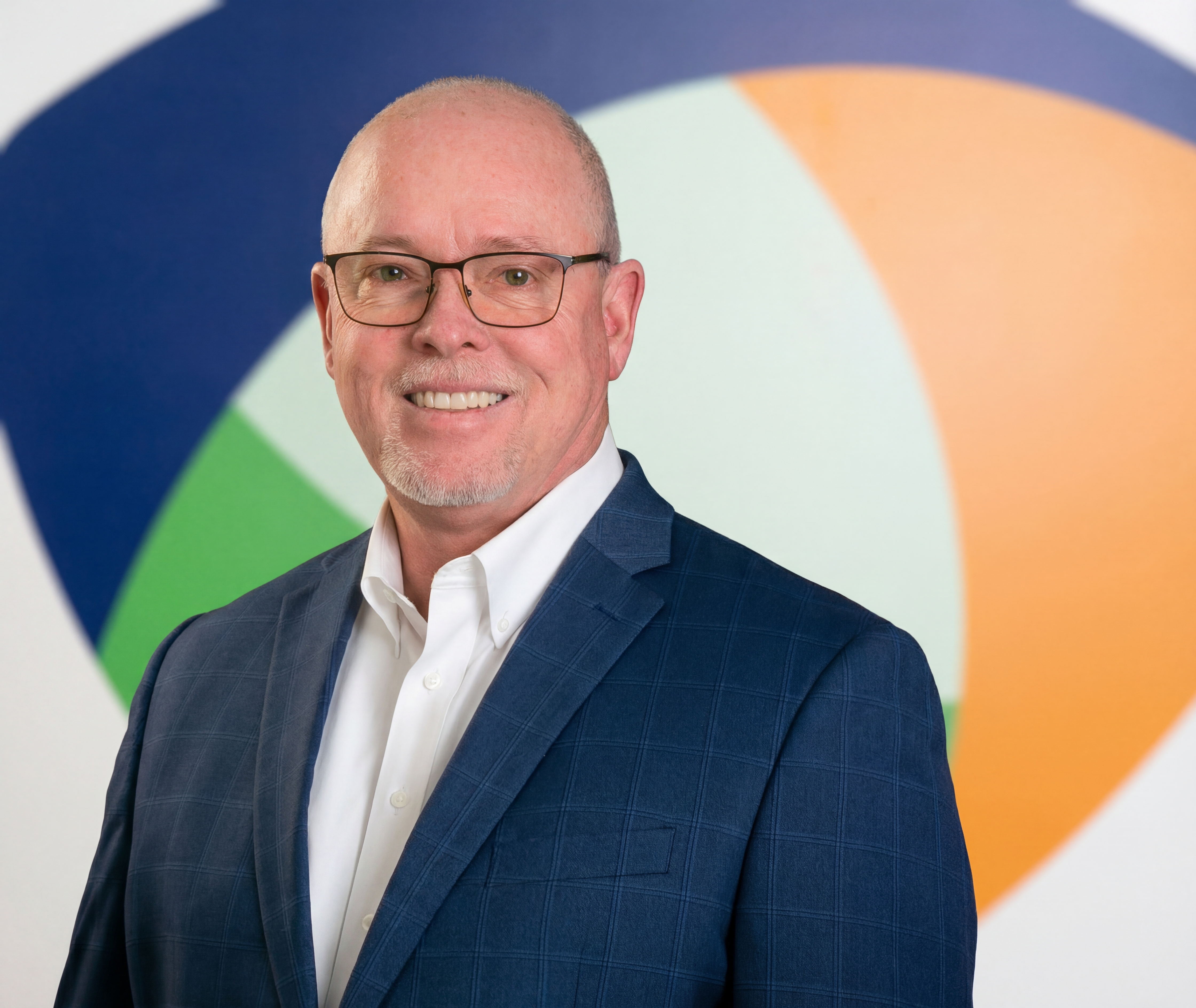Paul Glintenkamp headshot with Aphena logo background